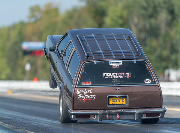Malibu wagon launching hard at the race track with a Denny's Nitrous Ready Driveshaft, photo courtesy of David Hilner Photography